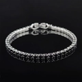 Macro view of silver tennis bracelet with black cubic zirconia and secure double clasp - 4mm-17cm / Black Zirconia