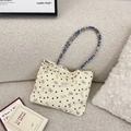 Detail of corduroy tote bag featuring colorful beaded handle and heart patterns - Off-white