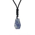 Detailed view of hexagonal natural blue sodalite stone pendant with woven black cord - Blue Sodalite