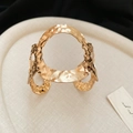 Detail view of the hammered gold texture and geometric cutouts on the adjustable cuff bracelet - Gold Geometric Hollow
