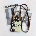 Flat lay of a brown knitted phone bag with cartoon bear pattern and leather handles - Coffee Bear-Cartoon