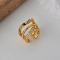 Three-layer gold-plated ear cuff with twisted texture and micro-pave cubic zirconia - Single Piece / 18K Gold