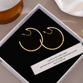 Detail of elegant gold hoop clip-on earrings inside a premium white jewelry gift box - 4cm Gold/Ear Clip
