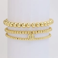 Set di tre braccialetti con perline dorate e un ciondolo rotondo con lettera U - Lettera U
