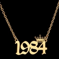 Golden 1984 birth year necklace with a small crown pendant on a fine link chain - 1984 / Gold
