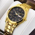 Gold men's quartz watch with black dial and date display on a white display pillow - Full Gold with Black Dial