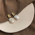 Macro detail of French vintage baroque pearl earrings with textured gold square pendants - Style 5