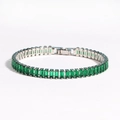 Detailed close-up of emerald green rectangle zircon stones set in a silver tennis bracelet - Platinum with Green Zircon