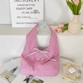 Close-up of pink checkered tote bag featuring a light blue ribbon bow and cotton texture - Blue & Pink