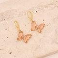 Close-up of champagne pink butterfly drop earrings with gold frame and micro-inlay - Peach