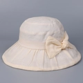 Dettaglio del tessuto in ramiè traspirante e dell'elegante fiocco sul cappello da sole - M (56-58cm) / Beige