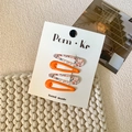 Set of four teardrop BB hair clips in solid orange and floral prints on a display card - Style 16-Orange Floral