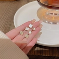 Three pairs of elegant gold bow stud earrings with pearls and white shell hearts - A794 Gold