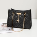 Women's black quilted shoulder bag with gold chain strap and deer charm detail - Black