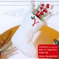White knitted Christmas stocking with red embroidered letter Y and holly leaves on a fireplace - Letter Y / White
