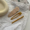 Close-up of three-piece hair clip set with marble texture and mustard yellow resin - Yellow Hair Clip 3Pcs Set