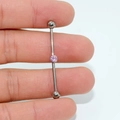 G23 titanium industrial barbell piercing with a central pink round zircon gem - Pink Zirconia