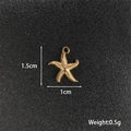Detailed view of a gold starfish pendant with 1.5cm height and 1cm width measurements - Starfish 2