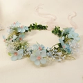 Close-up of a floral headband with blue flowers, green leaves and a pink ribbon - Blue HS-J7315LB