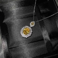 Elegant yellow oval gemstone necklace with silver chain on black silk jewelry display - Golden Diamond Necklace Tz-3