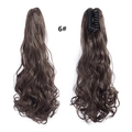 Detail showing the inner claw clip structure and long wavy dark brown ponytail hair - Tan