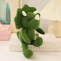 Handcrafted dark green knitted triceratops plush toy with soft horns and ridges - 25cm Triceratops