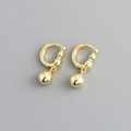 Detail view of gold hoop earrings featuring polished round bead charms in a studio setting - Smooth Bead Hoop Earrings (S-E1563) / Gold