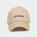 Detail shot of khaki cotton baseball cap featuring blue Gathering letter embroidery - Adjustable / Khaki