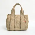 Quilted beige nylon handbag with double handles and metallic rivet details - Medium / Light Khaki