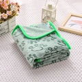 Detail of light green paw print flannel pet blanket showing soft texture and thick edging - Carved Green Paw Print