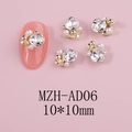 Close-up of 10x10mm floral nail charms with white pearls and square crystals on pink background - Square Crystal Gold Base (AD06)