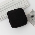 Minimalist black corduroy square pouch with a zipper closure for small items - Black