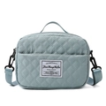 Light blue quilted travel bag with top handles and adjustable shoulder strap - Small / Mountain Blue