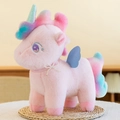 Pink plush unicorn toy with colorful mane, shimmering wings and pearl bow detail - Pink / 25cm