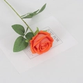 Single orange artificial velvet rose stem with green leaves on white background - Small Velvet Orange