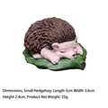 Miniature resin hedgehog figurine sleeping on green leaves, size 5x3.6x2.4cm decor - Hedgehog