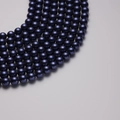 Strands of deep navy blue faux South Sea pearls with a high-luster polished finish - Navy Blue (636) 12mm/40cm