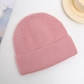 Pink knitted beanie with thick yarn texture flat lay on a white background - One Size / Pink