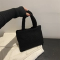 Schicke schwarze Plüsch-Handtasche für Damen mit weicher Textur und elegantem Griff - Schwarz