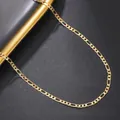 Close-up of golden Figaro chain with high-polish finish on a premium textured background - Figaro Chain (11) / Gold