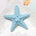 Detailed close-up of a blue resin starfish accessory on an embossed white plate - Light Lake Blue Starfish