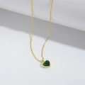 Detailed view of the heart-shaped green gemstone pendant with gold-plated bezel setting - Green