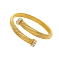 Detailed view of golden Tubogas spiral bracelet featuring shimmering pavé diamond ends - 8mm Gold Cross Bangle