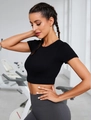 Close-up of black ribbed knit short sleeve yoga crop top for fitness and pilates - S / Black