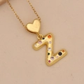 Golden heart necklace with multi-color zircon letter Z pendant on a beige background - Letter Z / Gold