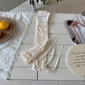 Creamy white ballet style leg warmers with delicate knit texture and silk ribbon bows - One Size / Cream Rice