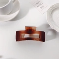 Elegant amber gradient rectangular hair claw clip on white surface with coffee cup - Amber Rectangular Style(FJ239)