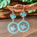 Macro shot of Bohemian turquoise and coral mandala earrings hanging on a branch - Double Layer Sunflower (S1168)