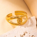 Elegant gold titanium steel ring with unique twisted knot design on a stone base - Gold 62-2