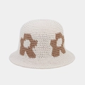 Detail of hand-knitted bucket hat featuring a large brown R letter and thick stitch texture - One Size / Beige